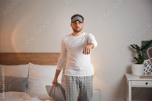 Male sleepwalker in bedroom...