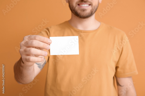 Young man with blank busine...