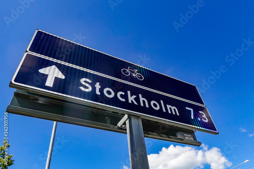Stockholm, Sweden A street sign for the city and bike path symbol.