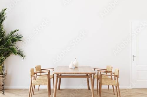 Fotografie, Obraz Dining room wall mock up with Areca palm, rattan dining set, wooden table on wooden floor