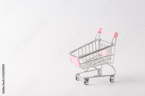 Shopping cart over white background