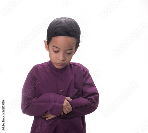 A Muslim kid with various poses isolated over white