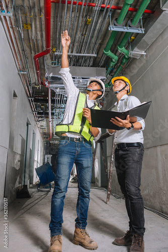 Project engineer, engineer and architect working on construction site, construction site engineer working on and inspect blueprint of project
