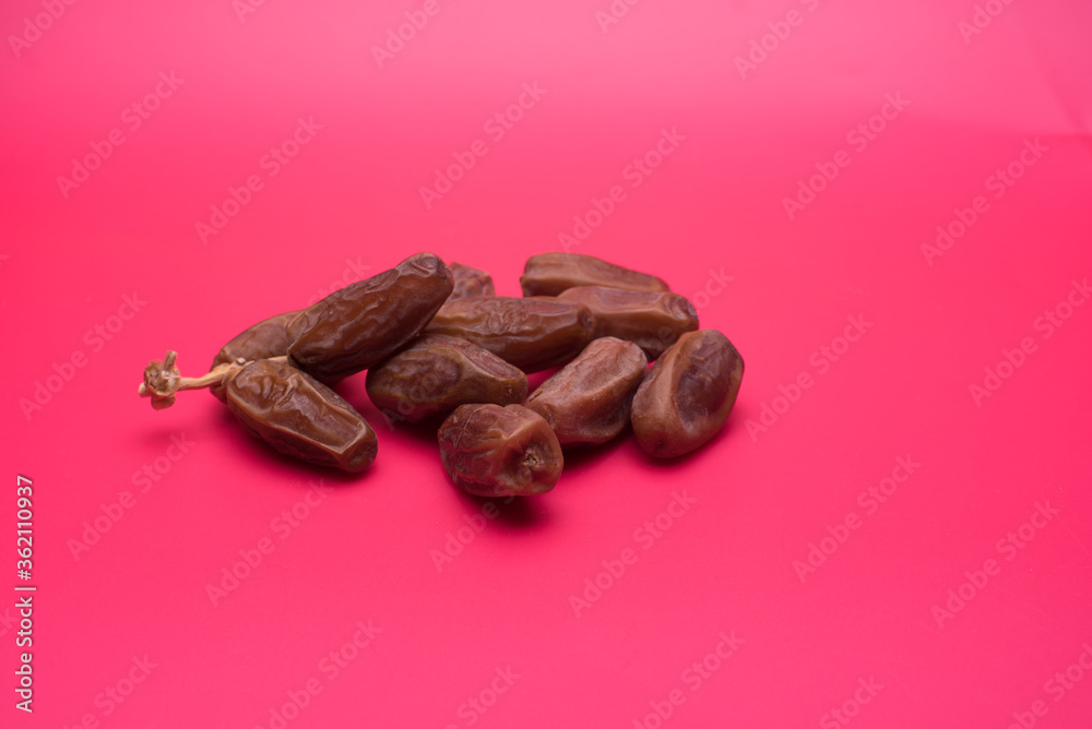 Obraz premium dry dates fruit over red background