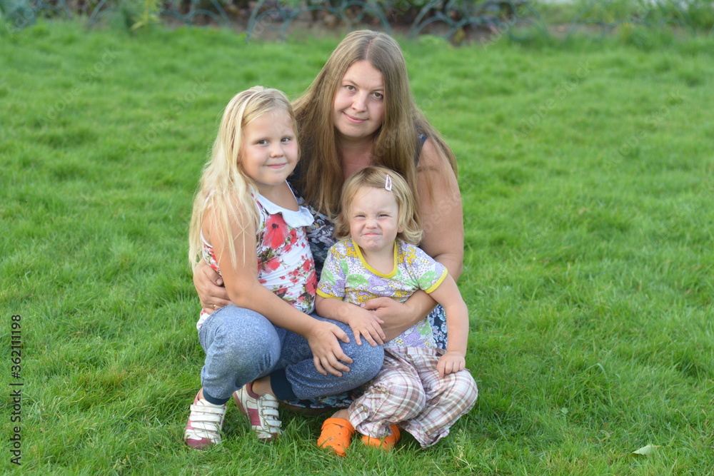 Happy family in the summer outside on a warm day. Happy family in the summer outside on a warm day.