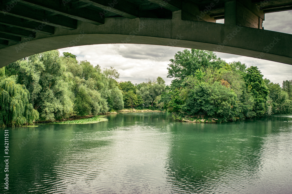 Fototapeta premium bridge over the green river