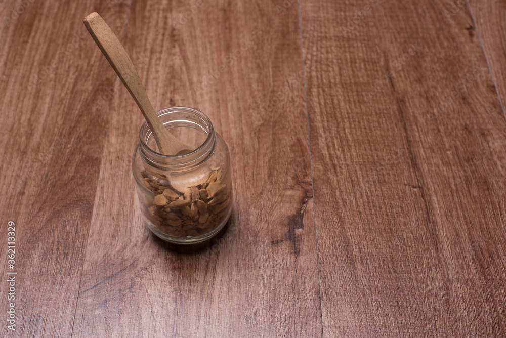 Cardamom herbs,over wooden background Cardamom herbs,over wooden background