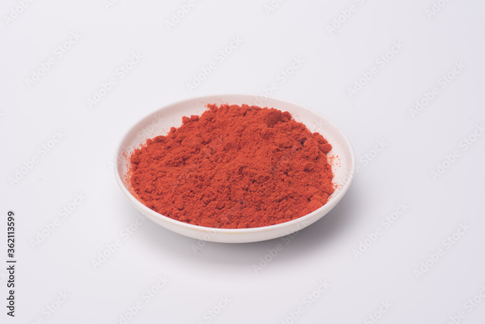Chili powder isolated over grey background Chili powder isolated over grey background