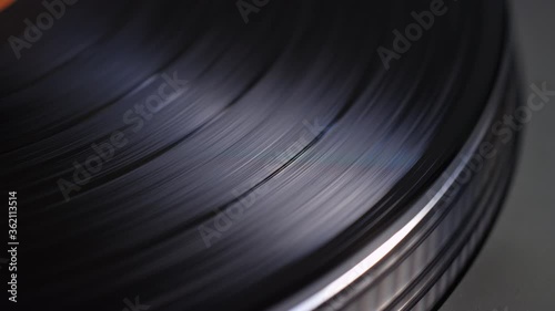 Extreme close up of a vinyl record spinning on a turntable
