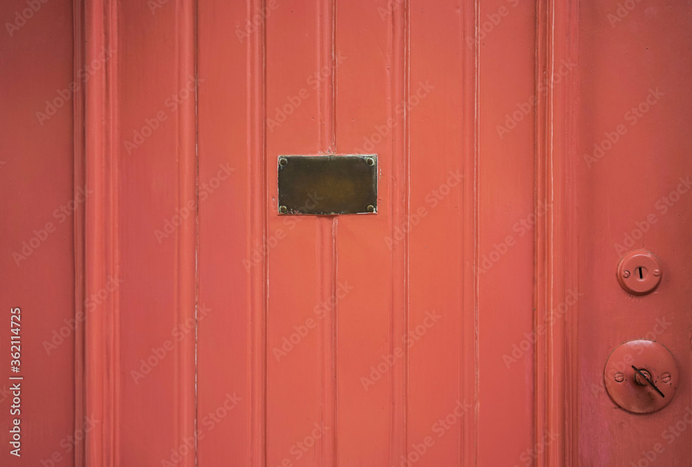 a painted wooden door with a brass plate a painted wooden door with a brass plate