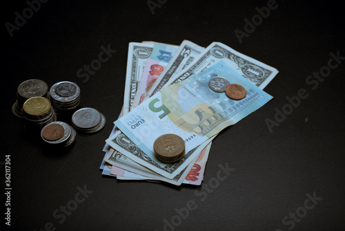 money sperad over dark background photo