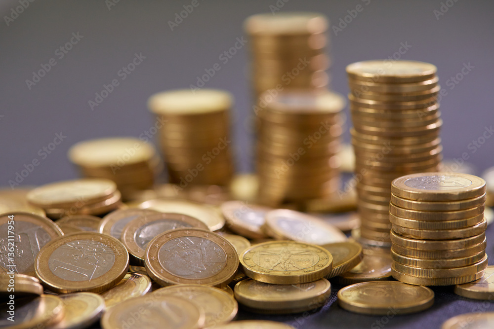 Stock Photo - Euro coins. Euro money. Euro currency.Coins stacked on each other in different positions. Money concept Stock Photo - Euro coins. Euro money. Euro currency.Coins stacked on each other in different positions. Money concept