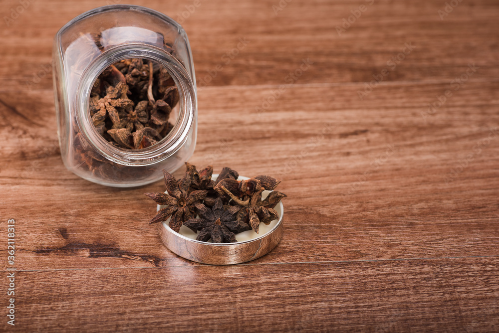 Star anise isolated over wooden background Star anise isolated over wooden background