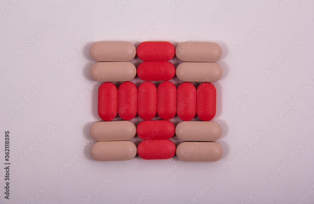 Pills and colored capsules out of the package. Color tablets and capsules from the wing view. Pills and colored capsules out of the package. Color tablets and capsules from the wing view.