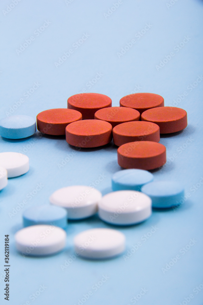 Pills and colored capsules out of the package. Color tablets and capsules from the wing view. Pills and colored capsules out of the package. Color tablets and capsules from the wing view.