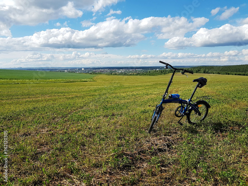 Bicycle on a green field