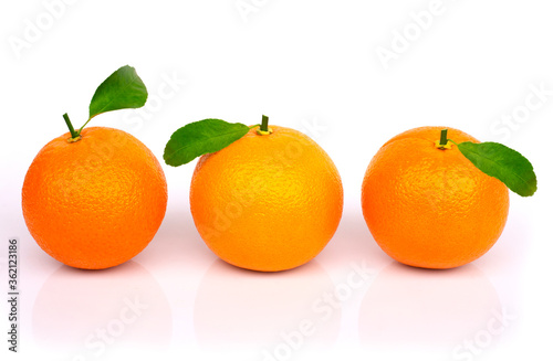 oranges with leaves isolated on white background.