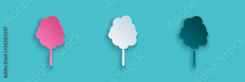 Paper cut Cotton candy icon isolated on blue background. Paper art style. Vector Illustration.