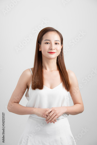 Attractive Asian woman thinking isolated on white background