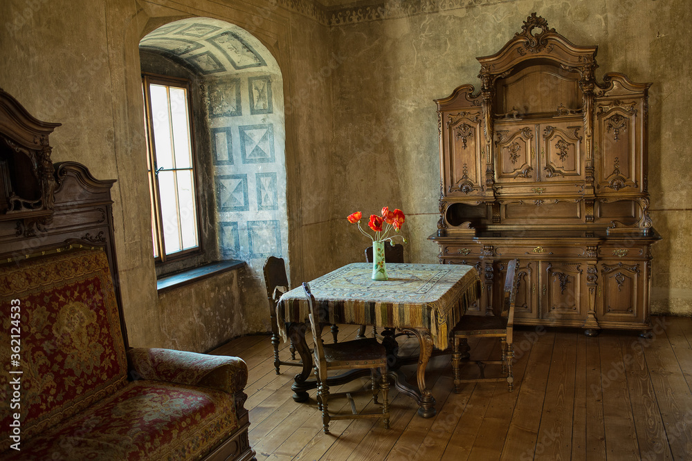 Fototapeta premium ORAVA CASTLE, SLOVAKIA - JUNE 16, 2018: Orava Castle - interior. Room with old wooden furniture. Slovak Republic. Central Europe