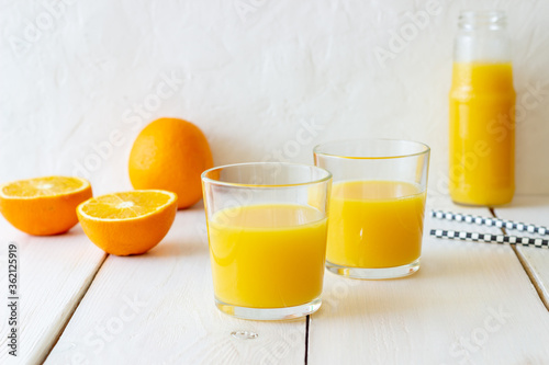 Freshly squeezed orange juice on a white background. Healthy eating. Diet. Vegetarian food.