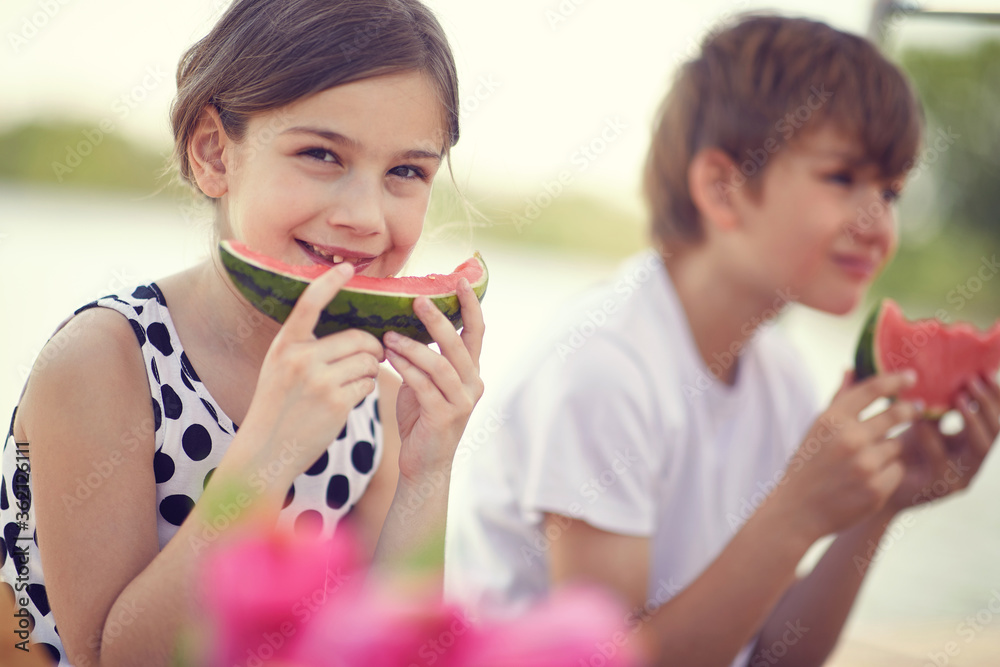 Cute kids eating fresh sweet red watermelon.v Cute kids eating fresh sweet red watermelon.v
