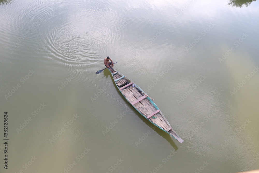 Fototapeta premium a boatman on river