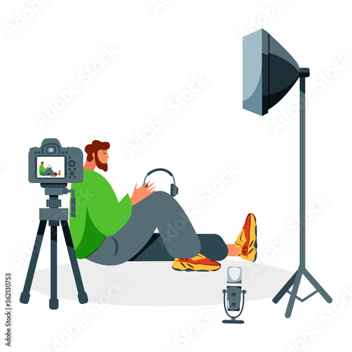 Video blogger recording video with camera and light. Vlog concept.
Cute vector illustration in flat style
