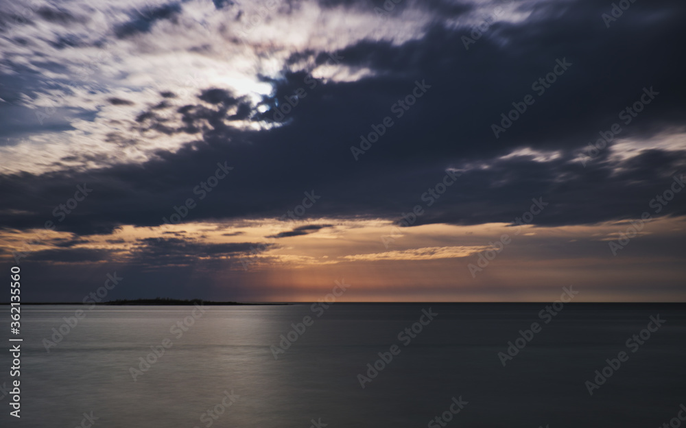 seascape at sunset rocks beach sea cloudy sky towers salento apulia 