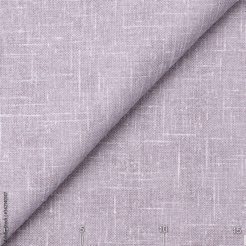 Fabric with natural texture, Cloth backdrop. Plain natural lilac linen fabric.