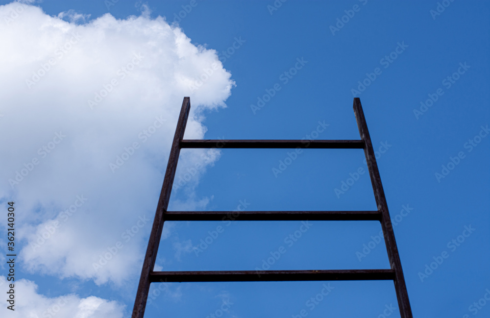 A stairway leading up to blue sky with sun over light cloud. Ladder of success. A stairway leading up to blue sky with sun over light cloud. Ladder of success.
