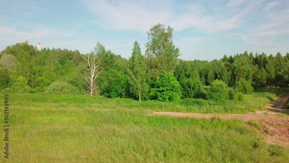 Aerial view of of natural green field and dense forest. Countryside. Nature landscape. Aerial view of of natural green field and dense forest. Countryside. Nature landscape.