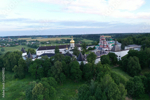 ancient white stone fortress at dawn taken from a drone