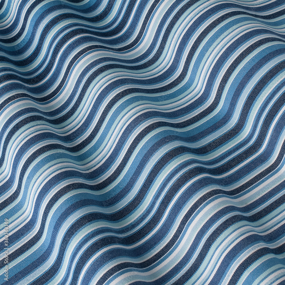 The pattern on the fabric is colorful beige and blue. Fabric with natural texture, Cloth backdrop. The pattern on the fabric is colorful beige and blue. Fabric with natural texture, Cloth backdrop.
