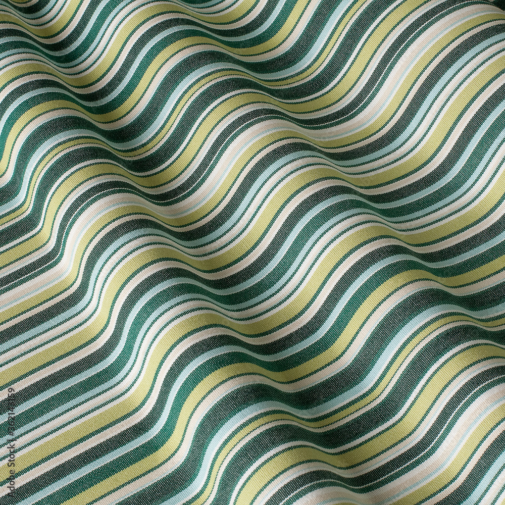 The pattern on the fabric is colorful beige-green. Fabric with natural texture, Cloth backdrop. The pattern on the fabric is colorful beige-green. Fabric with natural texture, Cloth backdrop.