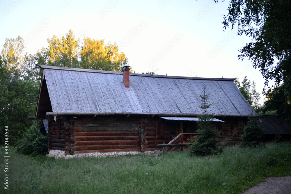 old wooden building in the forest at sunrise old wooden building in the forest at sunrise