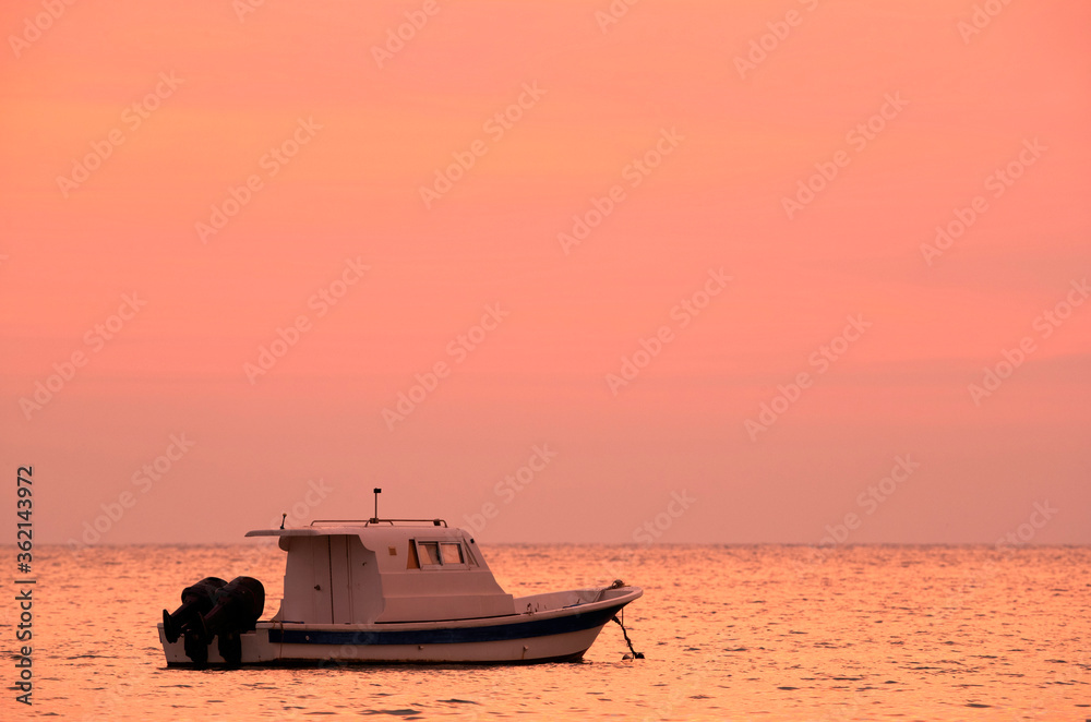 Speed boat during sunrise parked at Asker coast, Bahrain