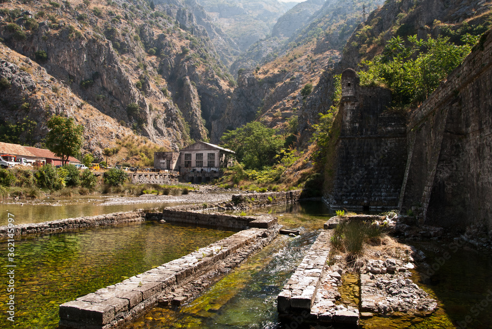 Old hydroelectric power plant is located in a mountain gorge Old hydroelectric power plant is located in a mountain gorge