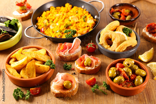 selection of spanish dish with paella, mussel, tapas