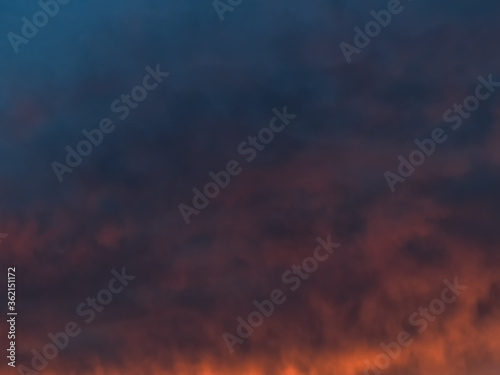 Dark gradient of the evening sky. Colorful cloudy sky at sunset. Sky texture, abstract nature background