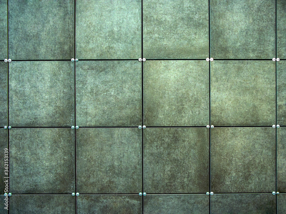 Wall made of gray square tiles Wall made of gray square tiles