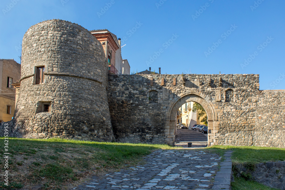 Close up medieval castle of Melfi. Medieval southern italian castle in close up and a blue clear sky in background. The castle is in stone bricks and have two towers.