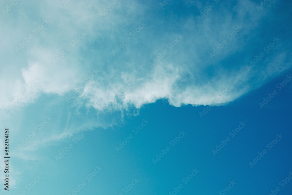 Blue tone of evening cloud and sky before sunset. Peaceful sky in calm atmosphere. A fluctuation weather make a dreamy and imaginative cloudscape. Wide blue sky background. Blue tone of evening cloud and sky before sunset. Peaceful sky in calm atmosphere. A fluctuation weather make a dreamy and imaginative cloudscape. Wide blue sky background.