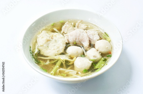 boiled soft slice pork and ball in clear soup on bowl