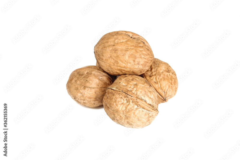Stack of nuts in shell isolated on white background. Walnuts fruit close up Stack of nuts in shell isolated on white background. Walnuts fruit close up