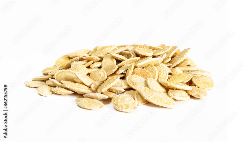 Group of salty pumpkin seeds in shell isolated on white surface. Snack food ready to eat Group of salty pumpkin seeds in shell isolated on white surface. Snack food ready to eat