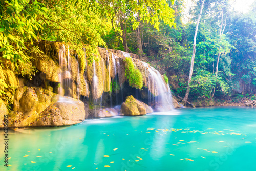 Tropical landscape with beautiful waterfall  wild rainforest with green foliage and flowing water. Erawan National park  Thailand