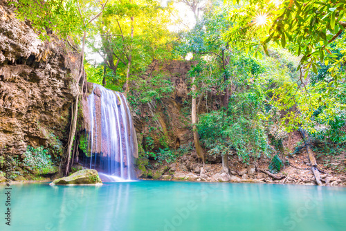 Tropical landscape with beautiful waterfall  wild rainforest with green foliage and flowing water. Erawan National park  Kanchanaburi  Thailand