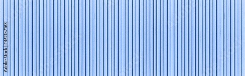 Panorama of Blue galvanized iron fence panels texture and seamless background