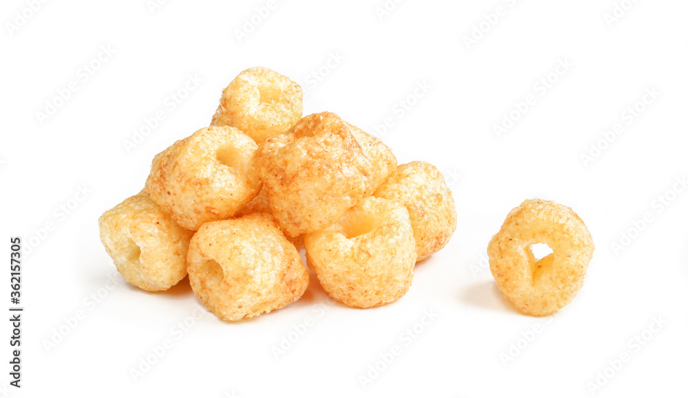 Pile of crispy peanut ring snacks isolated on white background.